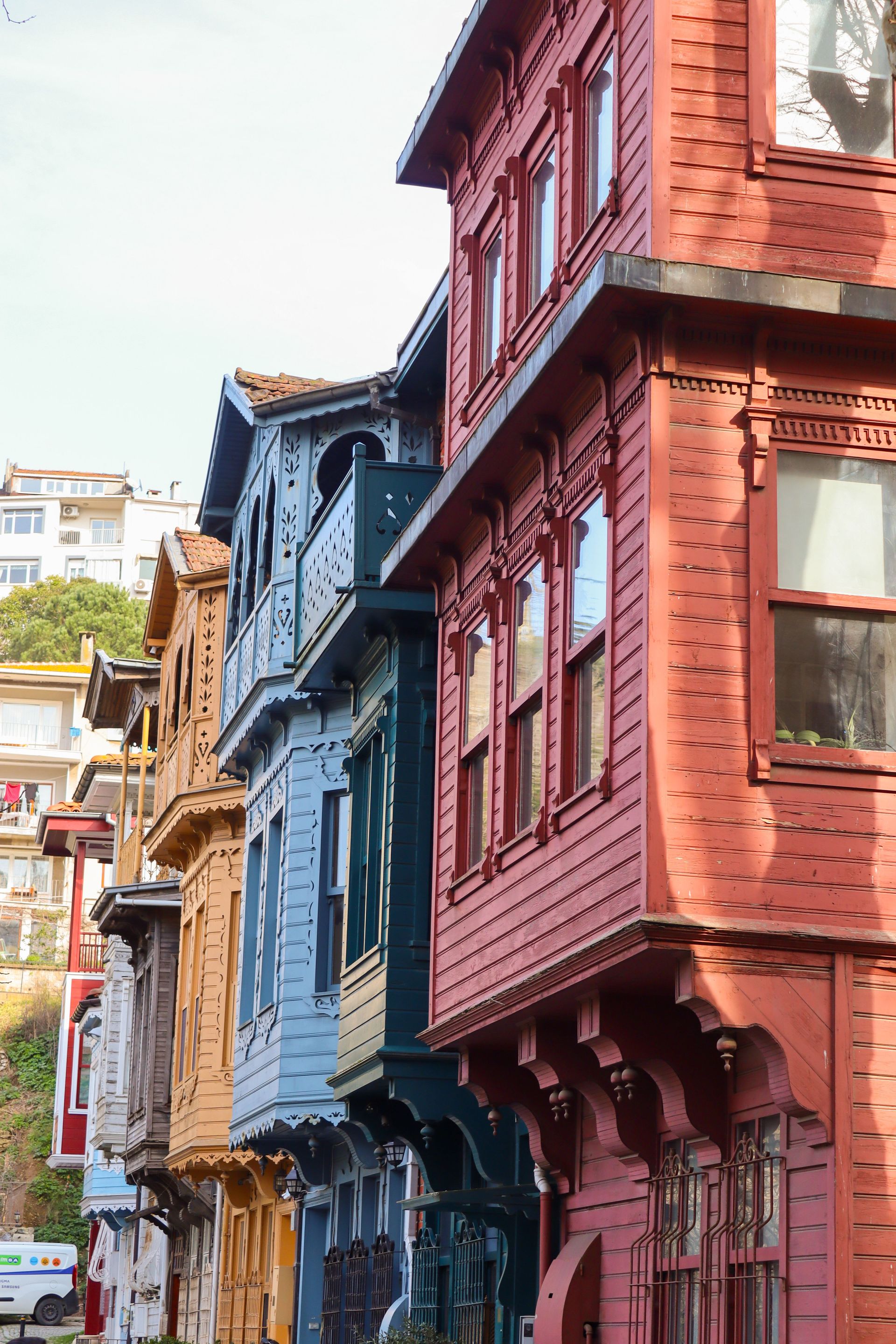 Vibrant wooden houses lining a street in Kuzguncuk, Istanbul, showcasing unique Ottoman architecture.