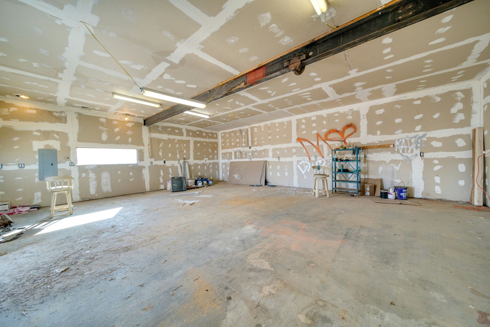 A large room with a lot of paint on the walls